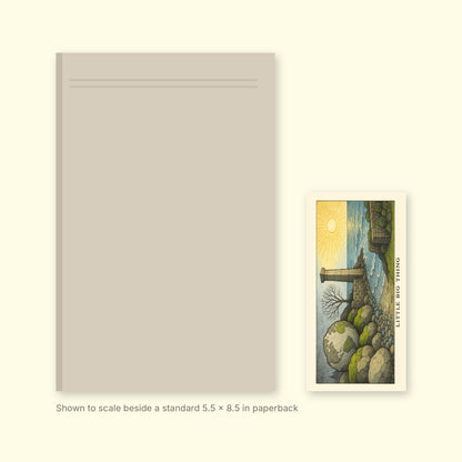 Little Big Thing V1 bookmark shown to scale beside a standard 5.5 x 8.5 inch paperback